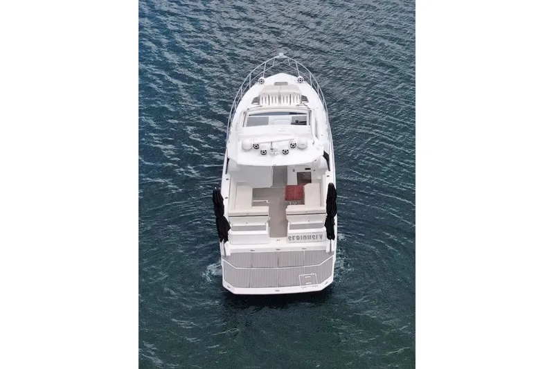 Slide: The Image of 2018 Cruisers Yachts 390 EC on water, aerial view, sleek design. - 14