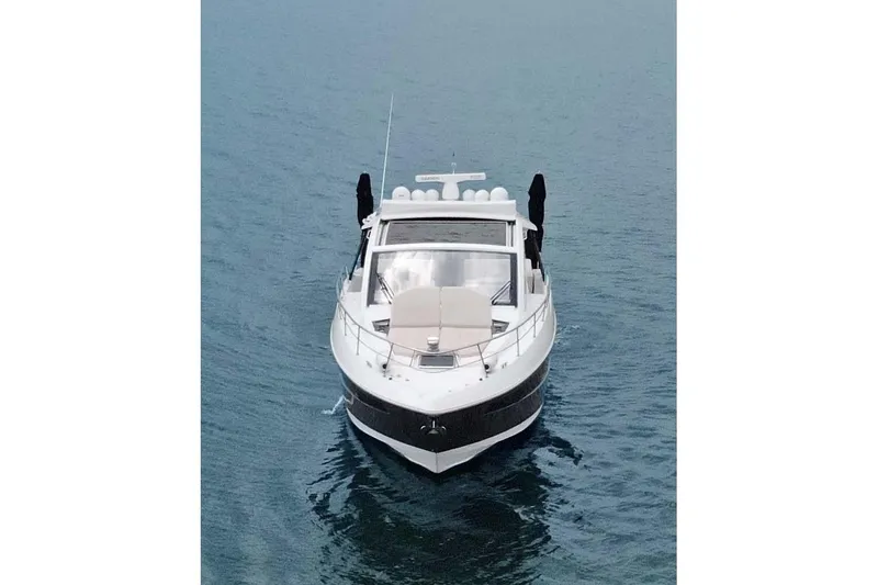 Slide: The Image of 2018 Cruisers Yachts 390 EC on calm water, front view. - 18