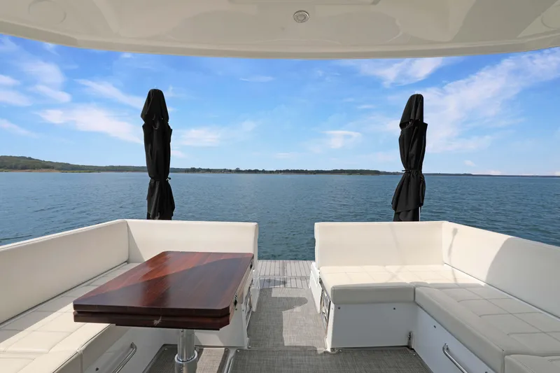 Slide: The Image of Luxury 2018 Cruisers Yachts 390 EC with elegant seating and scenic water view. - 26
