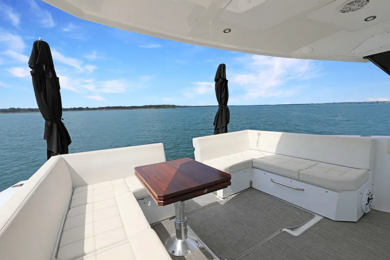 Slide: The Image of Luxurious 2018 Cruisers Yachts 390 EC with spacious deck seating and ocean view. - 29