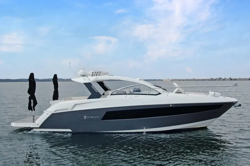 Slide: The Image of 2018 Cruisers Yachts 390 EC on calm water under blue sky. - 4