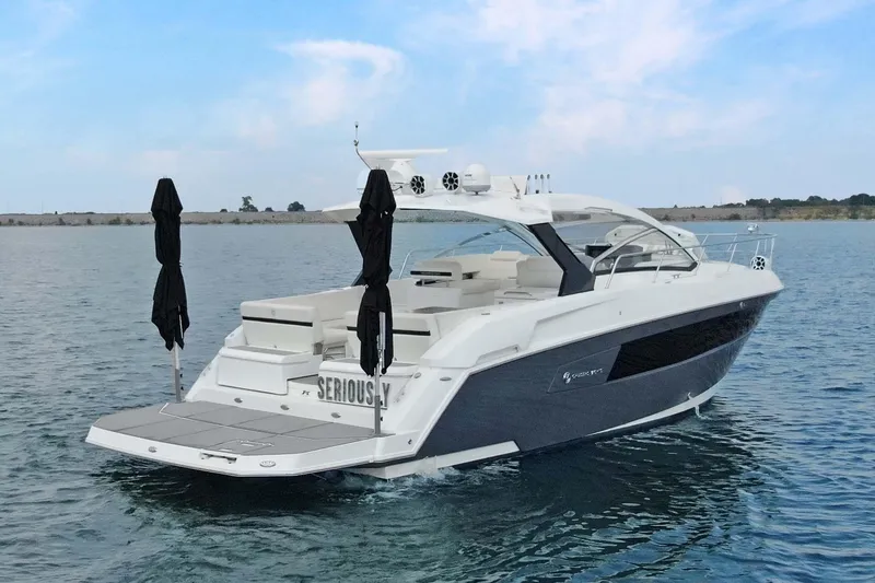 Slide: The Image of 2018 Cruisers Yachts 390 EC luxury boat on calm water, rear view. - 5