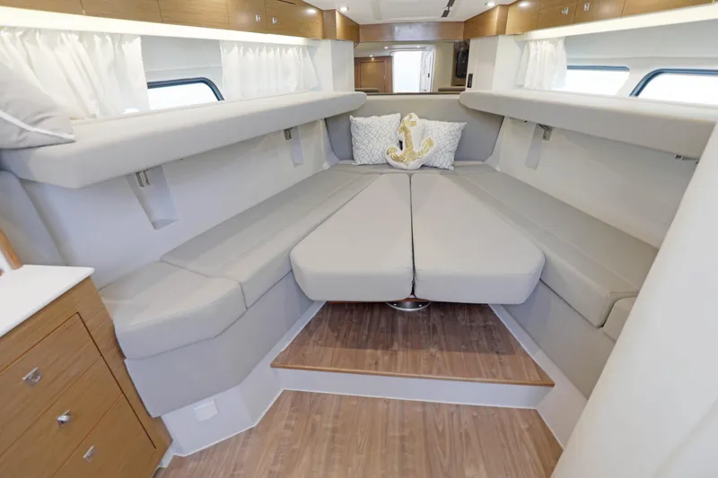Slide: The Image of Luxurious interior of 2018 Cruisers Yachts 390 EC with elegant seating and nautical decor. - 60