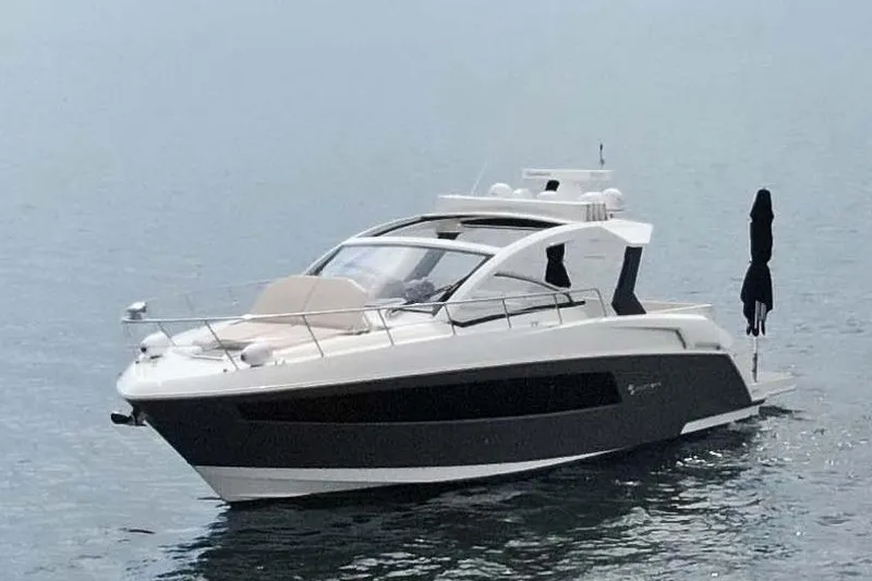 The Image of 2018 Cruisers Yachts 390 EC luxury boat on calm water. - 0