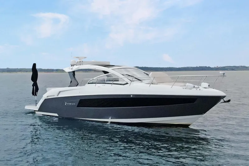 Slide: The Image of 2018 Cruisers Yachts 390 EC luxury boat on calm water, side view. - 3