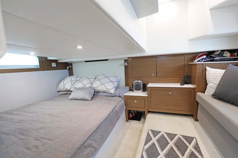Slide: The Image of Luxurious interior cabin of 2018 Cruisers Yachts 390 EC with cozy bed and modern decor. - 63