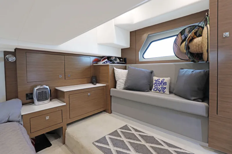 Slide: The Image of 2018 Cruisers Yachts 390 EC interior with cozy seating and modern wood cabinetry. - 65