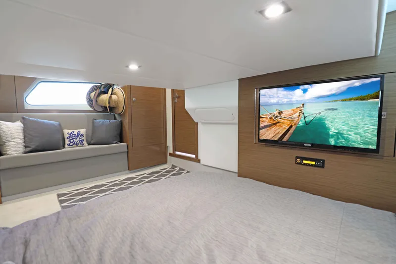 Slide: The Image of Luxurious interior of 2018 Cruisers Yachts 390 EC with TV and cozy seating. - 66