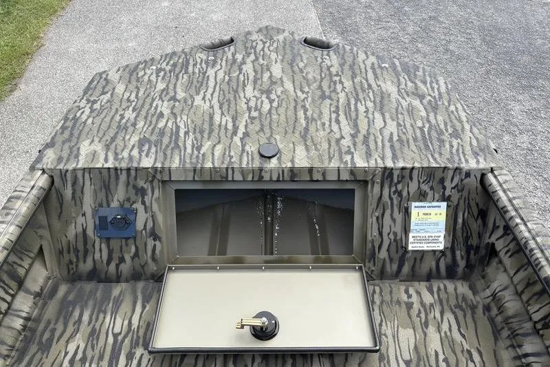 Slide: The Image of 2026 SeaArk DXS 1652 DKLD boat with camouflage pattern and storage compartment. - 15