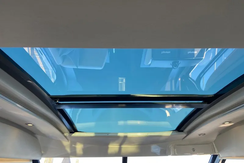 Slide: The Image of 2015 Sea Ray 470 Sundancer yacht with a panoramic sunroof view. - 12