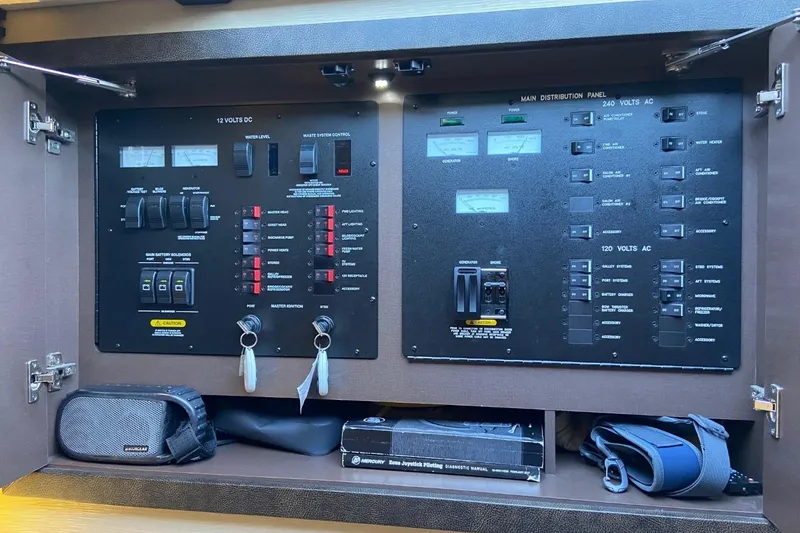 Slide: The Image of Electrical control panel of a 2015 Sea Ray 470 Sundancer yacht, featuring switches and gauges. - 20