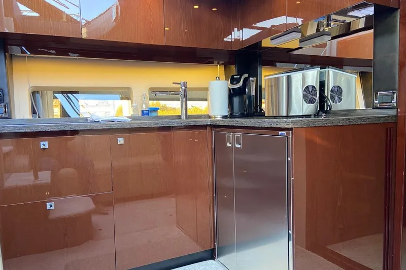 Slide: The Image of Luxurious kitchen interior of 2015 Sea Ray 470 Sundancer yacht with modern appliances. - 21