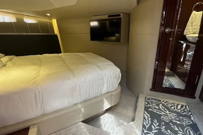 Slide: The Image of Luxurious bedroom interior of 2015 Sea Ray 470 Sundancer yacht with TV and ensuite bathroom. - 26