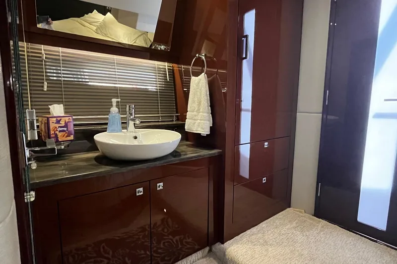 Slide: The Image of Luxurious bathroom interior of 2015 Sea Ray 470 Sundancer yacht with modern sink and cabinetry. - 29