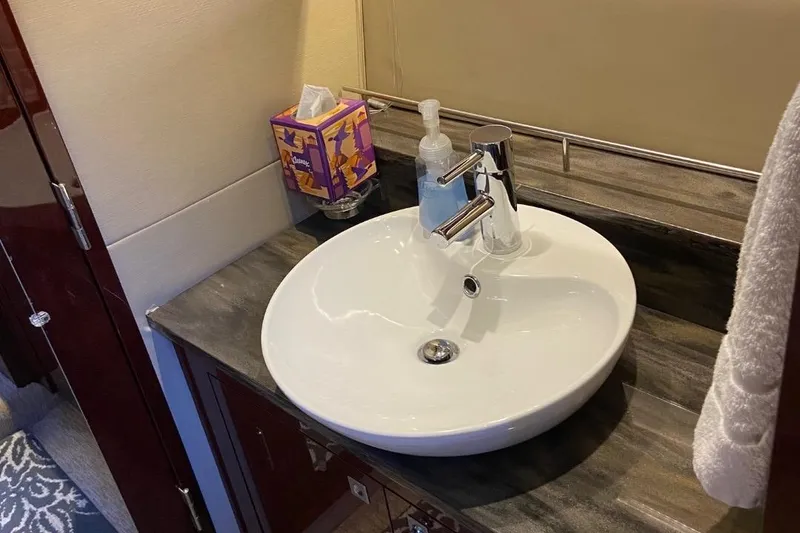 Slide: The Image of Luxurious bathroom sink on 2015 Sea Ray 470 Sundancer yacht with modern fixtures. - 30