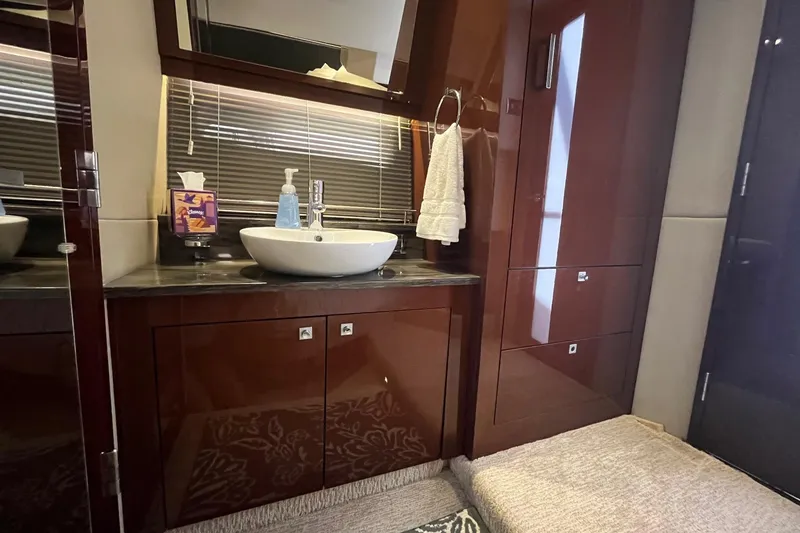 Slide: The Image of Luxurious bathroom interior of 2015 Sea Ray 470 Sundancer yacht with modern sink and cabinetry. - 31