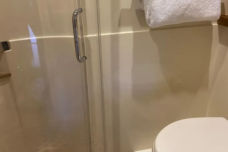 Slide: The Image of Bathroom interior of 2015 Sea Ray 470 Sundancer yacht with shower and towel. - 33