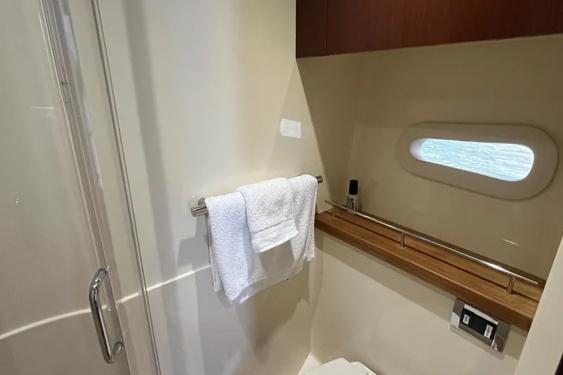 Slide: The Image of Luxurious bathroom interior of 2015 Sea Ray 470 Sundancer yacht with towel and window. - 34