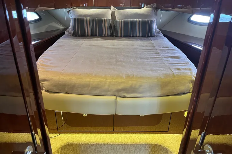 Slide: The Image of Luxurious bedroom interior of 2015 Sea Ray 470 Sundancer yacht with elegant bedding. - 35