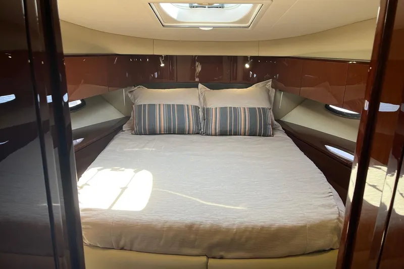 Slide: The Image of Luxurious cabin interior of 2015 Sea Ray 470 Sundancer yacht with cozy bed. - 36