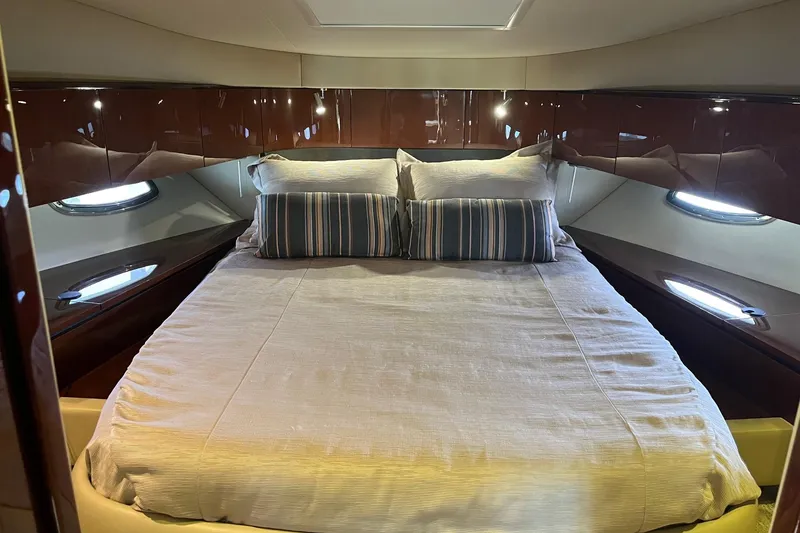 Slide: The Image of Luxurious bedroom interior of 2015 Sea Ray 470 Sundancer yacht with elegant bedding. - 37