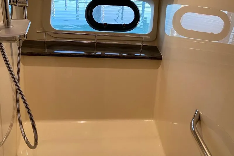 Slide: The Image of Luxurious bathroom interior of 2015 Sea Ray 470 Sundancer yacht with window view. - 44