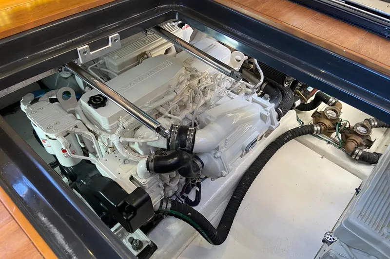 Slide: The Image of Engine compartment of a 2015 Sea Ray 470 Sundancer yacht, showcasing mechanical components. - 46