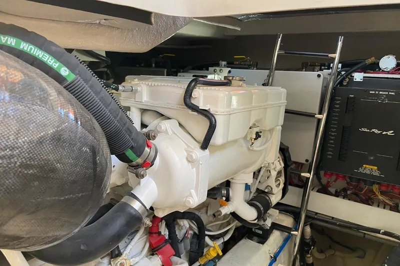 Slide: The Image of Engine room of 2015 Sea Ray 470 Sundancer, showcasing mechanical components and wiring. - 50