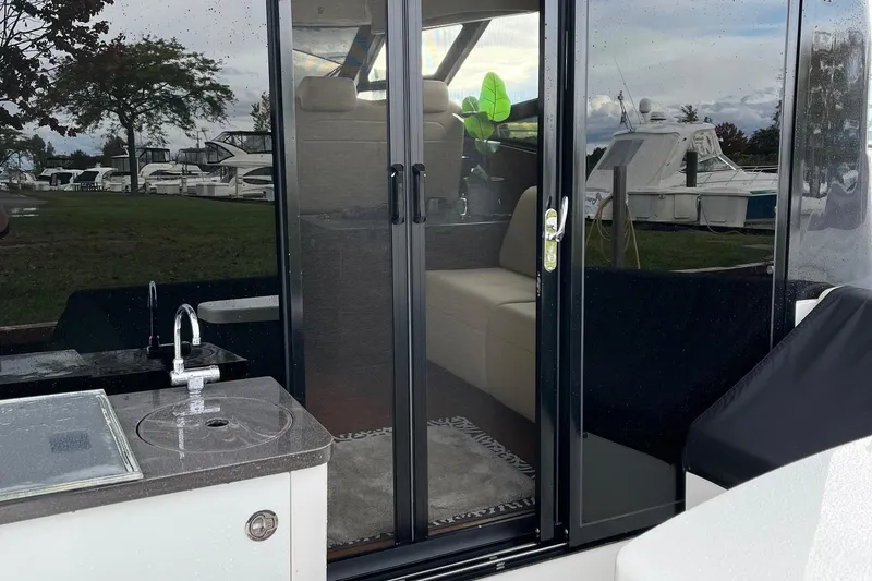 Slide: The Image of 2015 Sea Ray 470 Sundancer yacht with outdoor sink and sliding glass doors. - 53