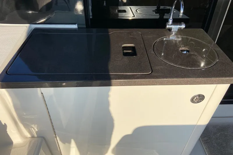 Slide: The Image of Outdoor kitchenette on 2015 Sea Ray 470 Sundancer yacht with sink and countertop. - 55