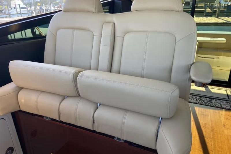 Slide: The Image of Luxurious beige leather seating on 2015 Sea Ray 470 Sundancer yacht, showcasing comfort and elegance. - 8