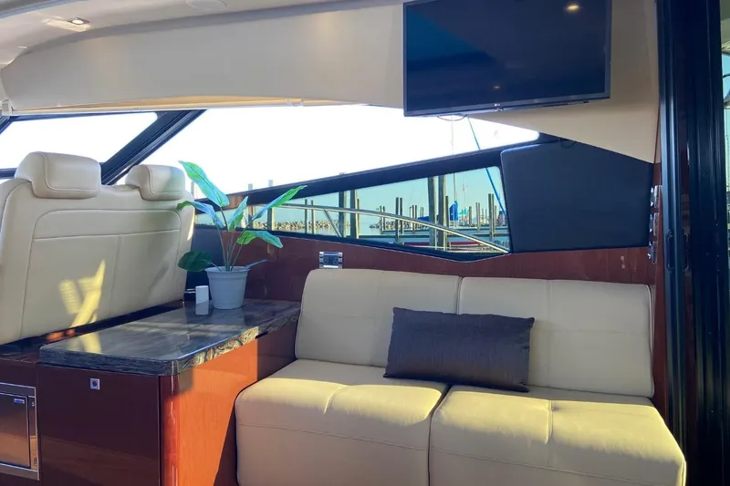 Slide: The Image of Luxurious interior of 2015 Sea Ray 470 Sundancer yacht with plush seating and modern decor. - 9