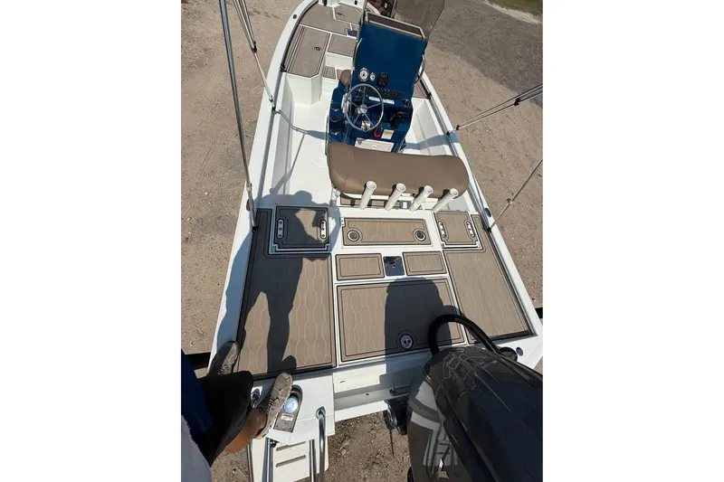Slide: The Image of 2026 Avid 21 FSX boat interior with steering console and rod holders. - 5