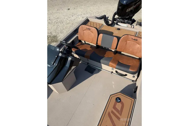 Slide: The Image of 2026 Avid 18 Rogue SC boat interior with brown and black seating. - 5
