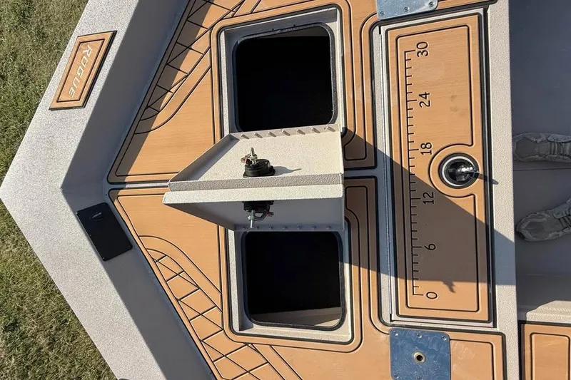 Slide: The Image of Avid 18 Rogue SC 2026 boat deck with storage compartments and measurement markings. - 8