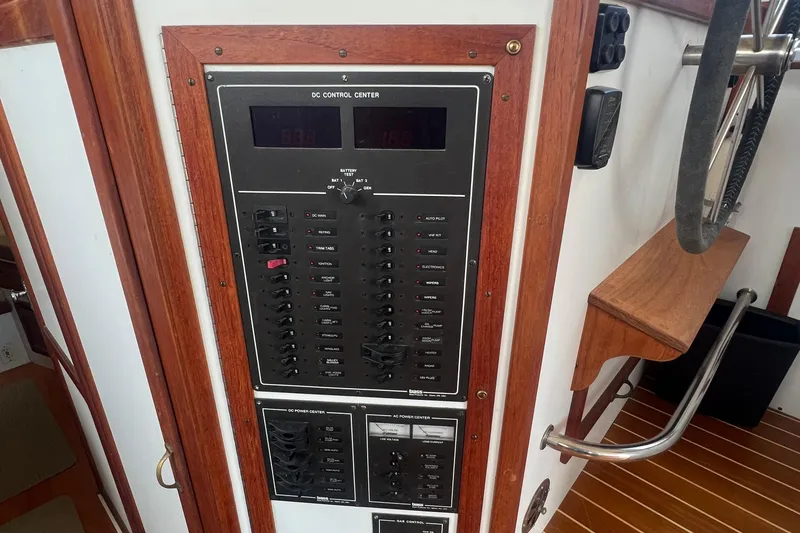 Slide: The Image of Control panel of 1994 Zimmerman Marine Z36 Sedan Cruiser with wooden trim and steering wheel. - 11