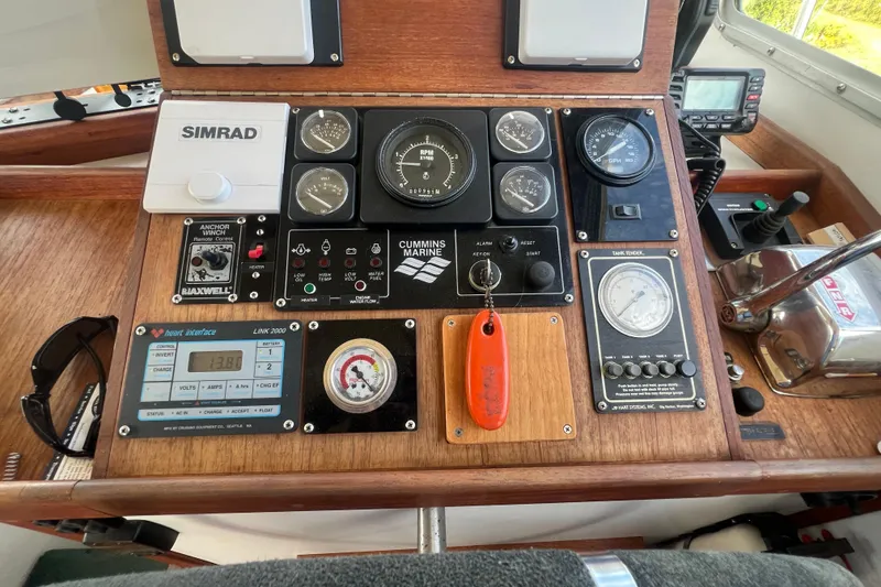 Slide: The Image of Control panel of a 1994 Zimmerman Marine Z36 Sedan Cruiser with various gauges and controls. - 12