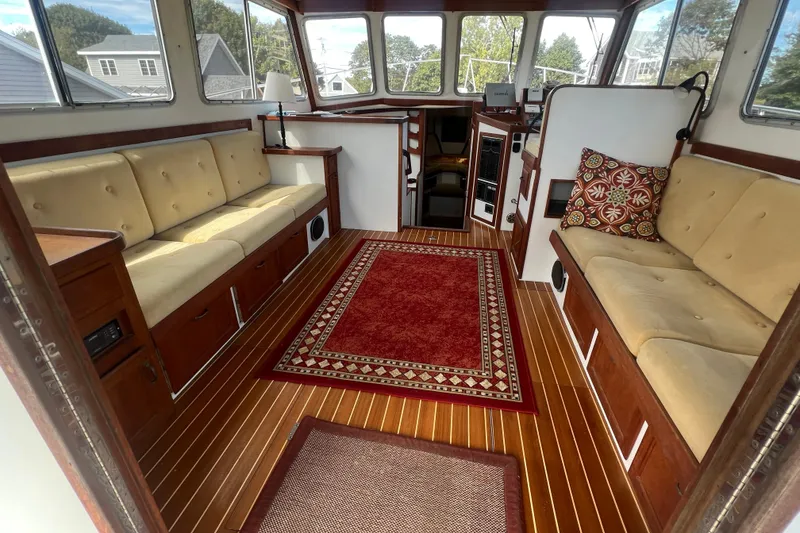 Slide: The Image of Interior of 1994 Zimmerman Marine Z36 Sedan Cruiser with plush seating and elegant wood flooring. - 2