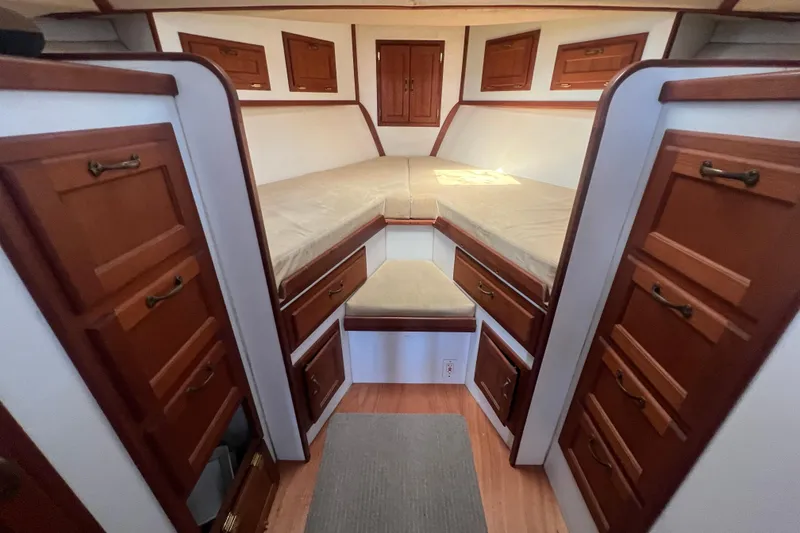 Slide: The Image of Interior of 1994 Zimmerman Marine Z36 Sedan Cruiser with wooden cabinetry and cushioned seating. - 6
