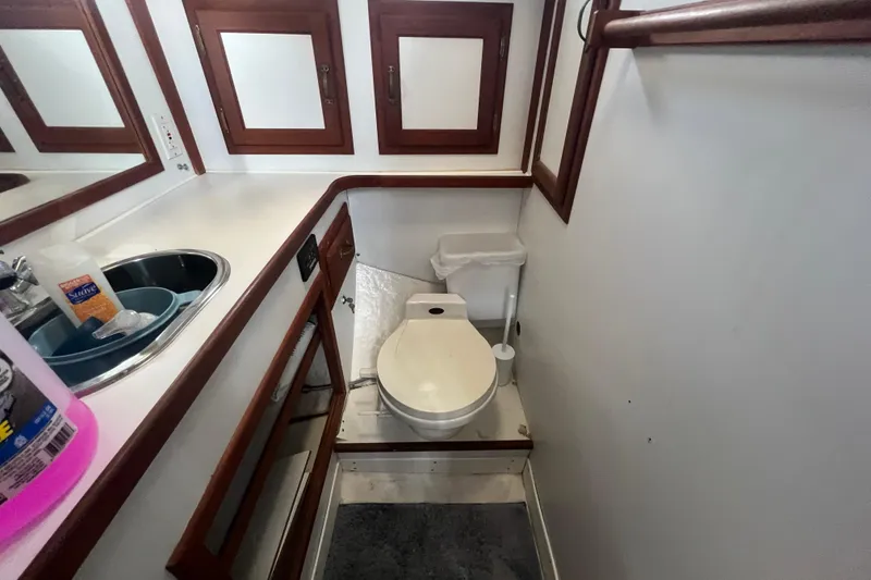 Slide: The Image of Bathroom interior of 1994 Zimmerman Marine Z36 Sedan Cruiser with sink and toilet. - 7