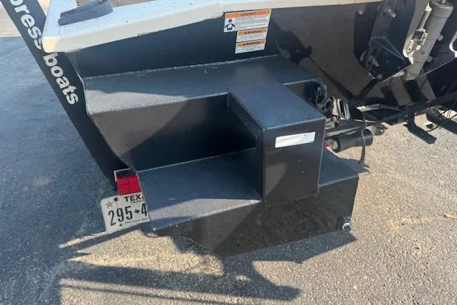Slide: The Image of Rear view of a 2019 Xpress H20 boat with visible license plate and step platform. - 10