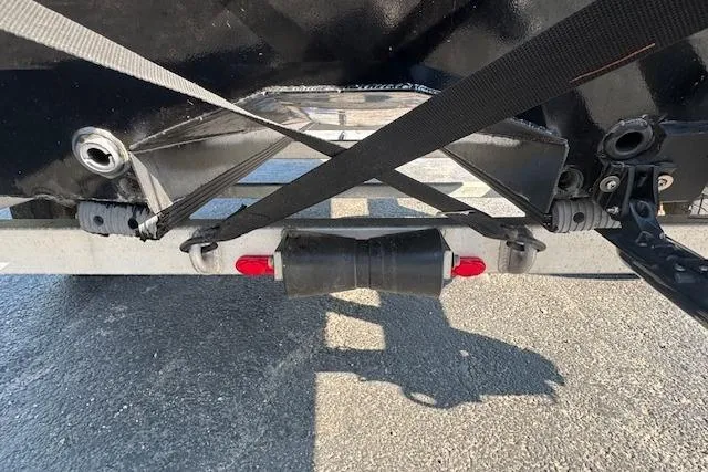 Slide: The Image of Trailer hitch and straps securing a 2019 Xpress H20 boat. - 12