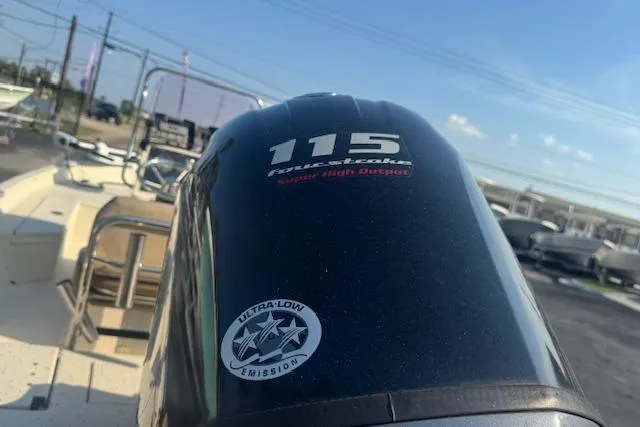 Slide: The Image of Outboard motor on 2019 Xpress H20 boat, featuring 115 horsepower and ultra-low emissions. - 14