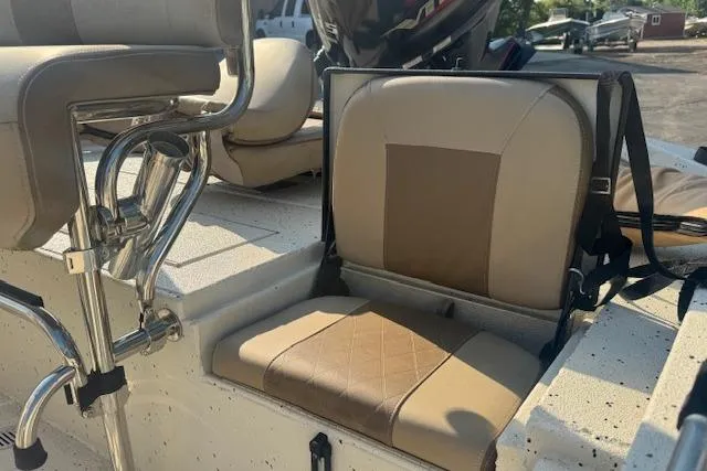 Slide: The Image of 2019 Xpress H20 boat interior with beige seating and chrome details. - 24