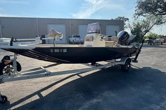 Slide: The Image of 2019 Xpress H20 boat on trailer in parking lot, sunny day. - 4