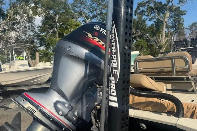 Slide: The Image of 2019 Xpress H20 boat with Yamaha engine and Power-Pole Pro II, docked outdoors. - 8