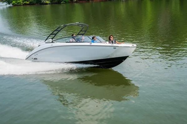 Slide: The Image of 2026 Yamaha Boats 252S cruising on a serene lake with passengers enjoying the ride. - 5