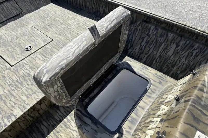 Slide: The Image of 2026 SeaArk Shadow 19 V Center Console with open storage compartment, camo design. - 4