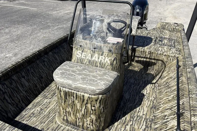 Slide: The Image of 2026 SeaArk Shadow 19 V Center Console boat with camouflage design and center steering console. - 5