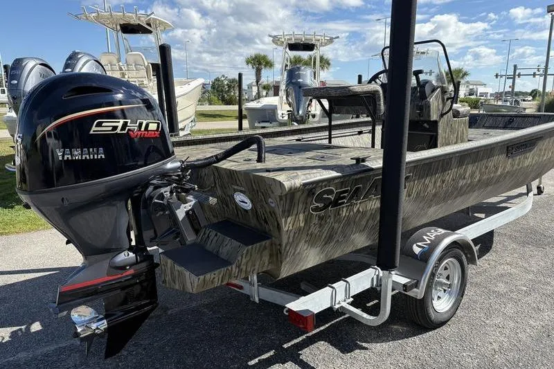 Slide: The Image of 2026 SeaArk Shadow 19 V Center Console boat on trailer, featuring Yamaha outboard motor. - 15
